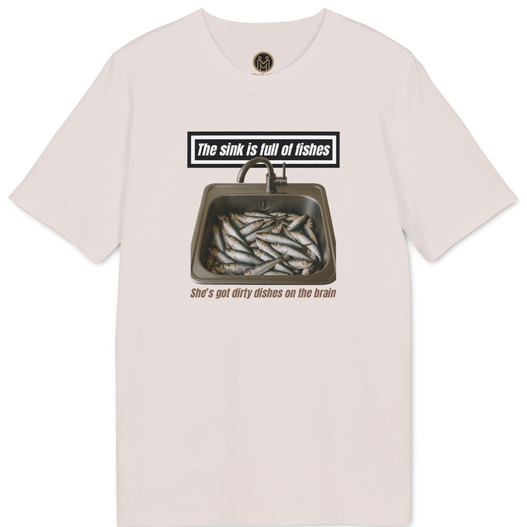 A light pink short-sleeve t-shirt with a graphic print on the front showing a sink filled with fish and the text 'The sink is full of fishes' and 'She's got dirty dishes on her brain'.