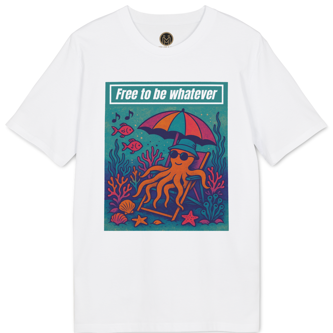 A white short-sleeve crewneck t-shirt featuring a colorful graphic print of an octopus relaxing under a pink and orange umbrella on a teal ocean floor, with the text 'Free to be whatever' above it.