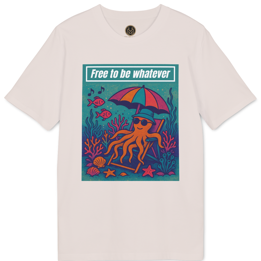 A light beige crewneck t-shirt featuring a colorful graphic print of an octopus relaxing on a beach chair under a rainbow umbrella with the text 'Free to be whatever' on a teal banner.