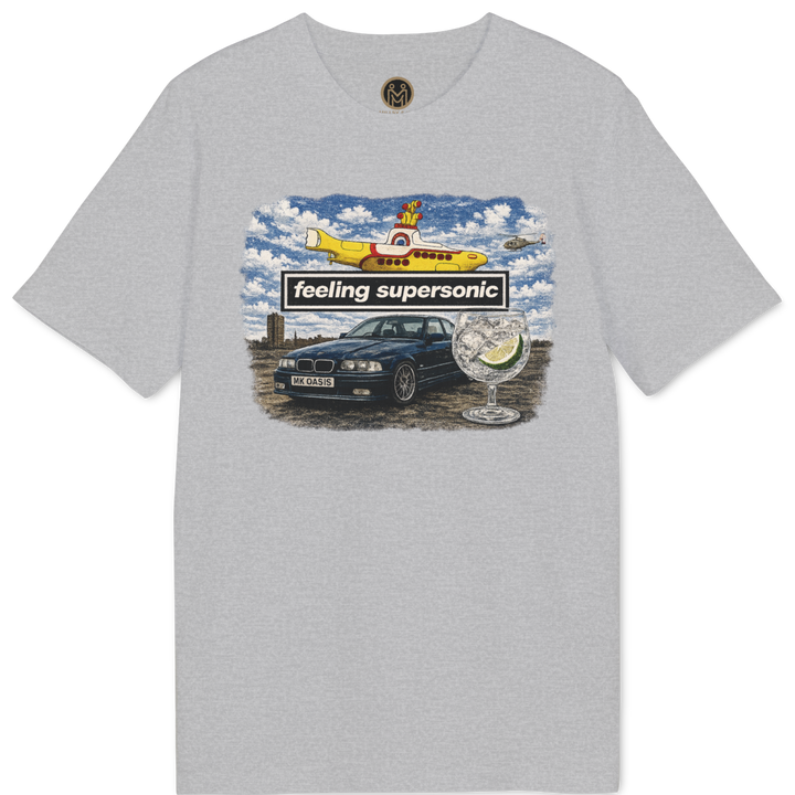 A light gray heather crewneck t-shirt featuring a colorful graphic print on the front with a yellow airplane, a black car, and the text &