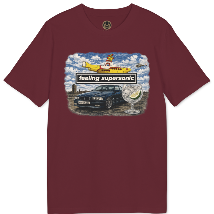 A maroon short-sleeve crewneck t-shirt featuring a colorful graphic print on the chest with a car, a yellow airplane, and the text &