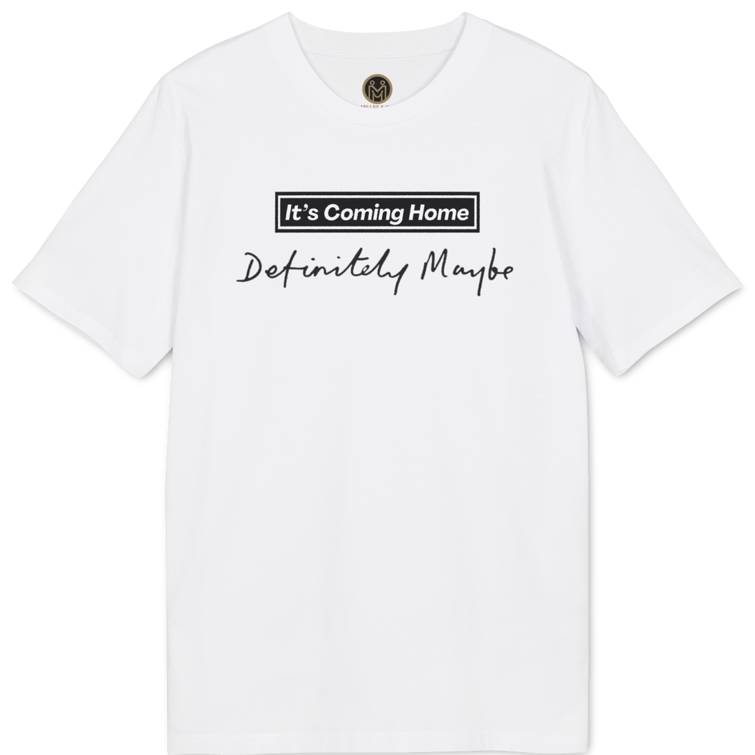 A white short-sleeve crewneck t-shirt with a black graphic print on the chest reading 'It's Coming Home' inside a rectangular box and 'Definitely Maybe' in cursive script below, displayed on a clean white background.